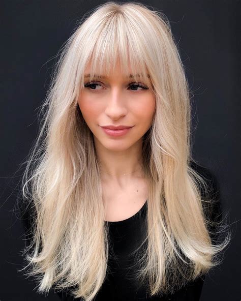 blonde haircut with bangs